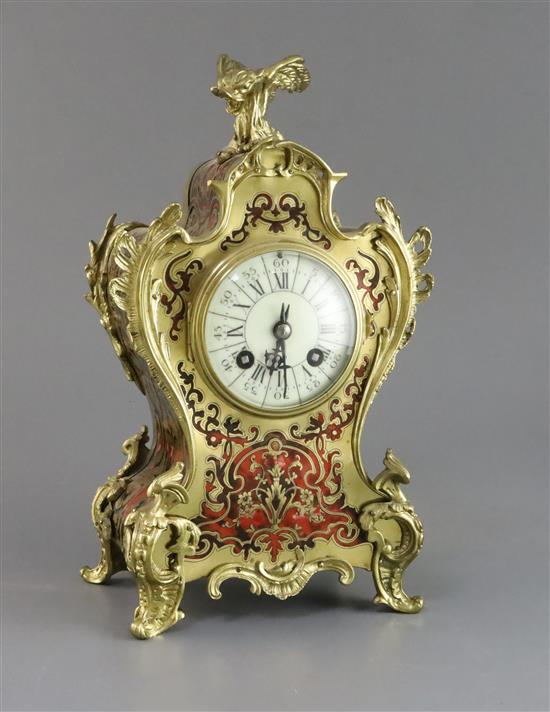 An early 20th century French ormolu and red boulle mantel timepiece, height 12in.